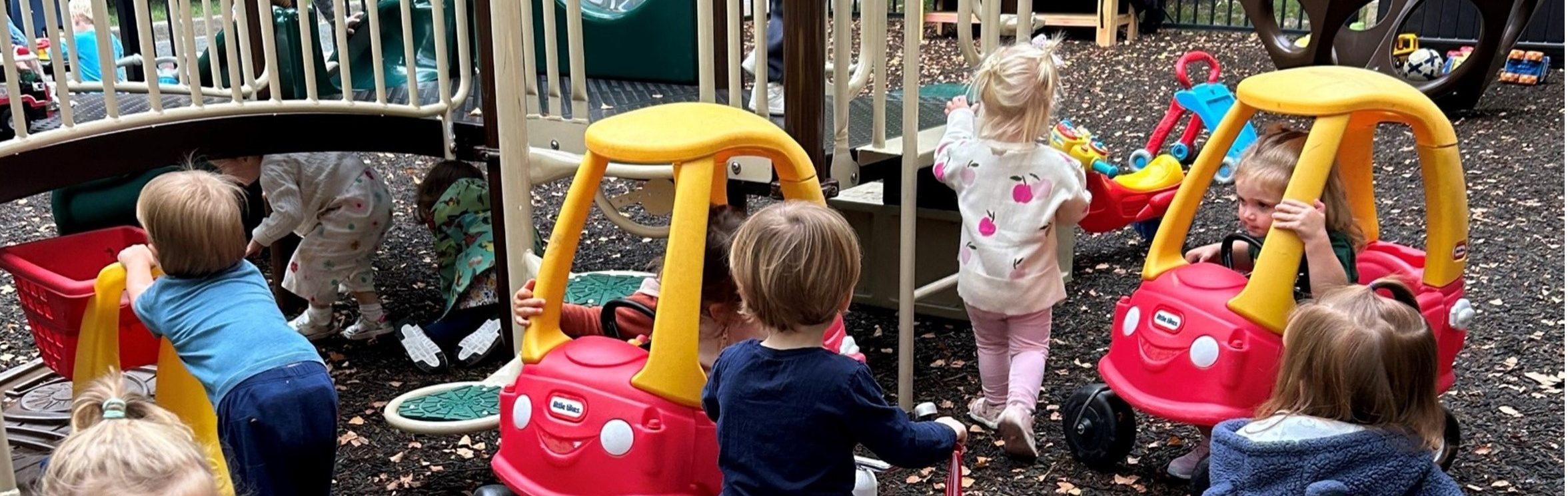 Church entrance with landscaping and a welcoming door